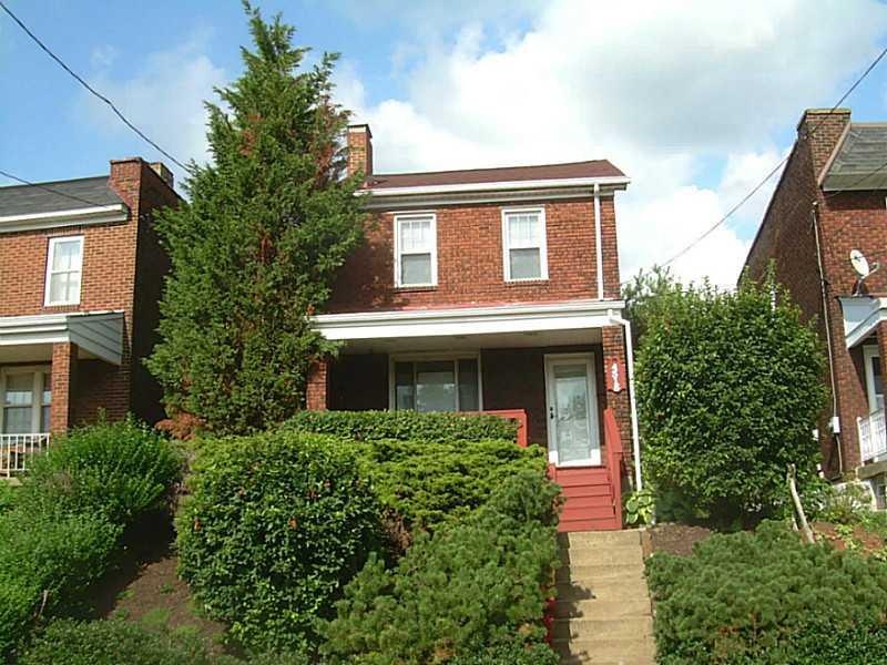Exterior Front. Nice brick home, sitting above the