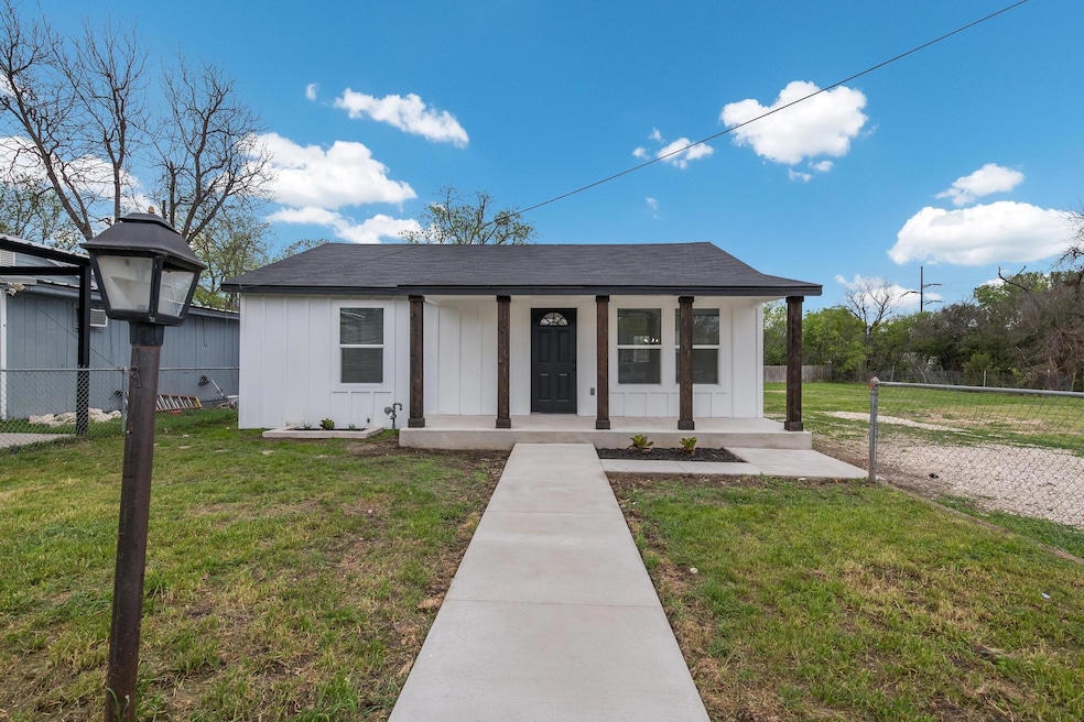 Bungalow-style house with a porch and a front lawn