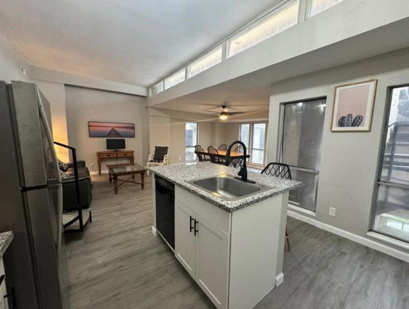 Kitchen with freestanding refrigerator, dark wood