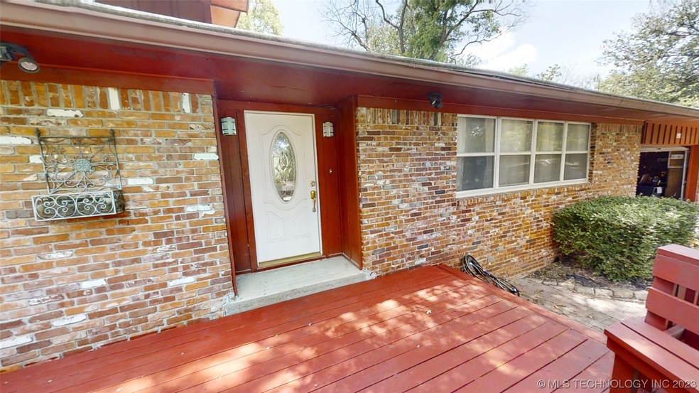 Generous front deck with built in benches provides