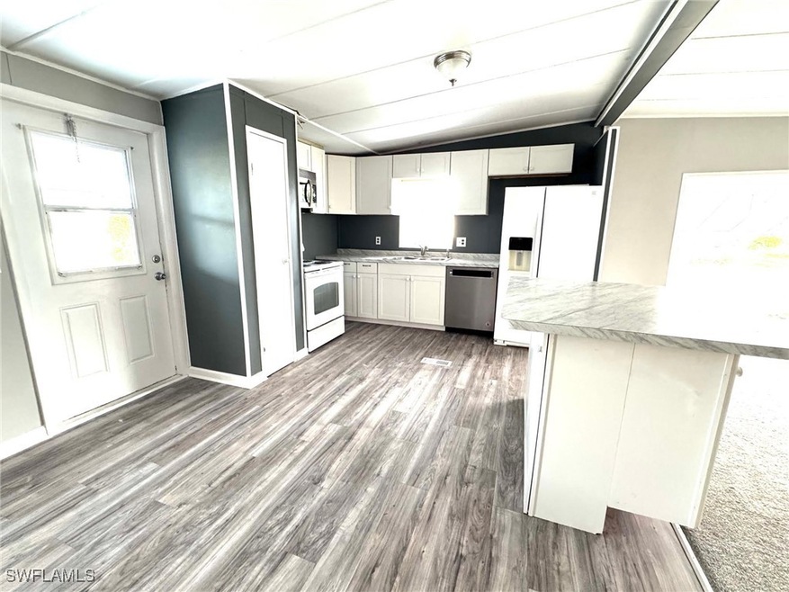 Kitchen with appliances with stainless steel finis