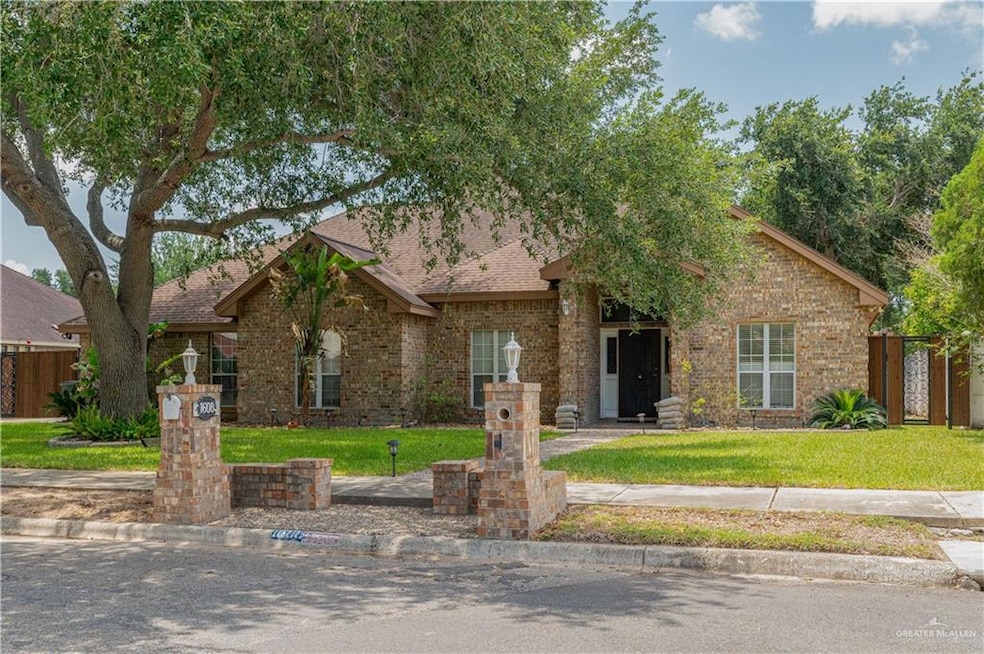 View of front facade with brick siding and roof with shingles
