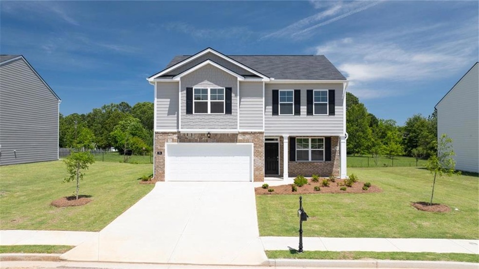 View of front of property with a garage and a fron