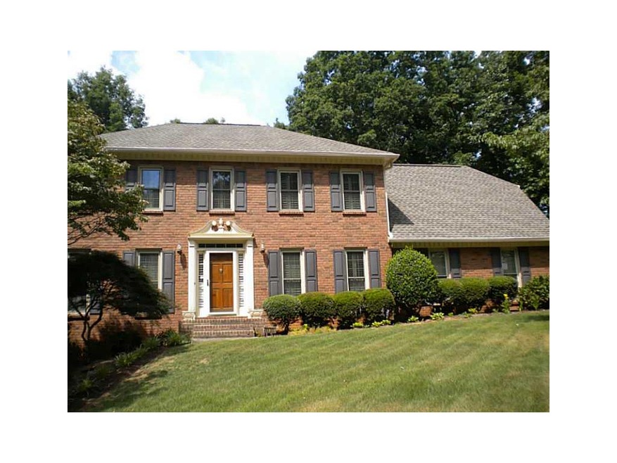 Exterior Front. A well manicured lawn compliments 