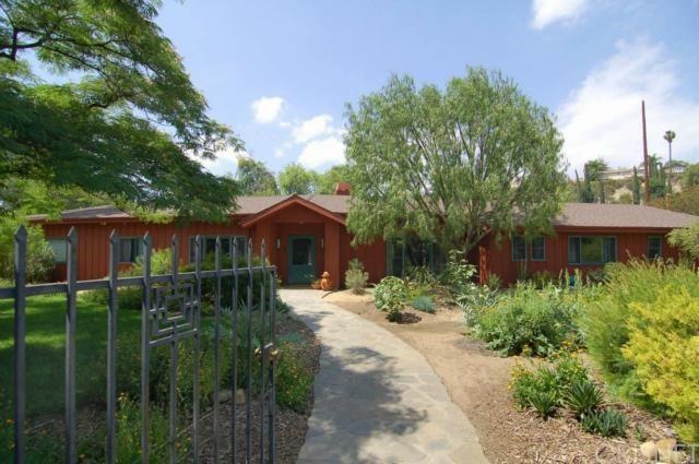 Located on gated corner lot.