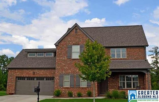 4 side brick home with covered front and back porc