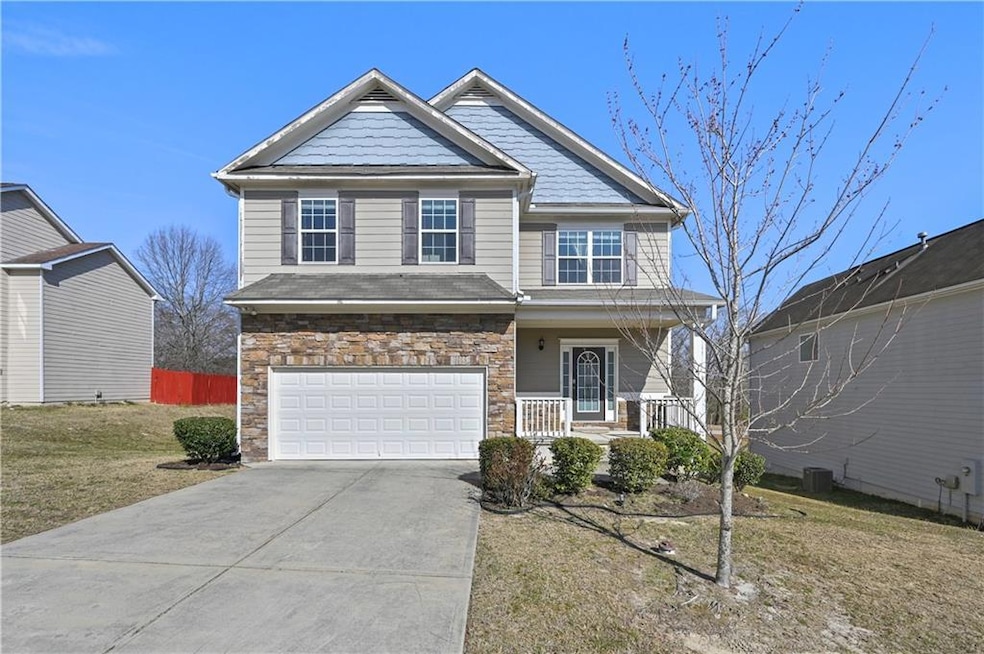 Craftsman inspired home with driveway, a garage, s