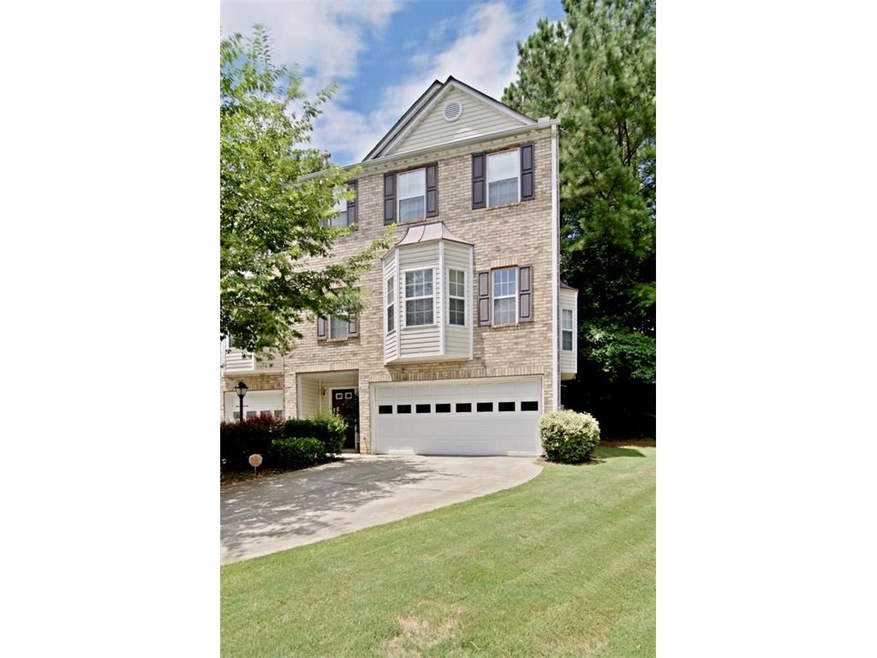 Beautiful brick front townhome with bay windows!