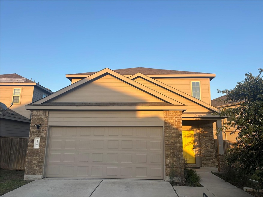 View of front of property with concrete driveway,