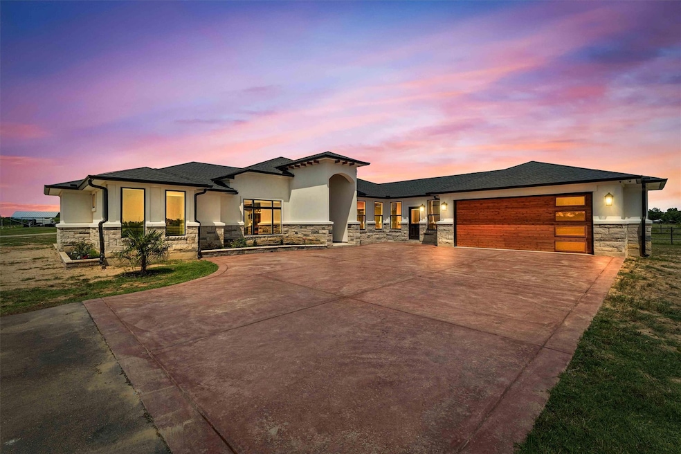 View of front of home featuring stone siding, stu