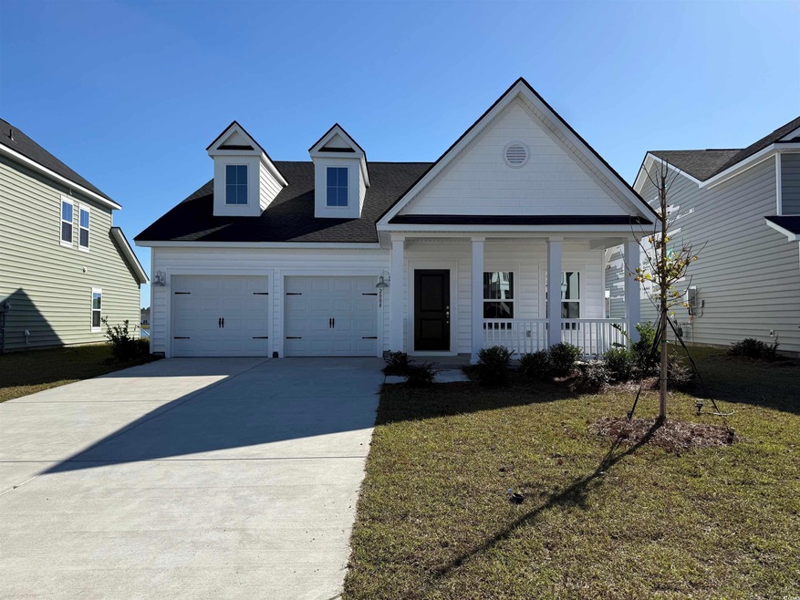 View of front of property featuring a front lawn, 