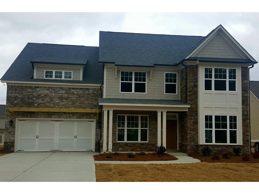 The Hamilton at homesite 11B has a mixed brick, st