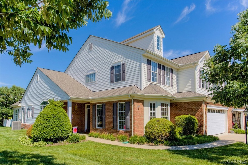 Home's Brick/Vinyl Clad Exterior with Porch