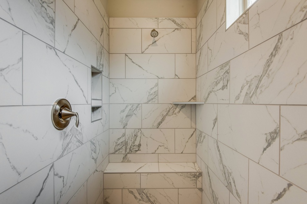 Amazing upgraded tile in luxury master shower