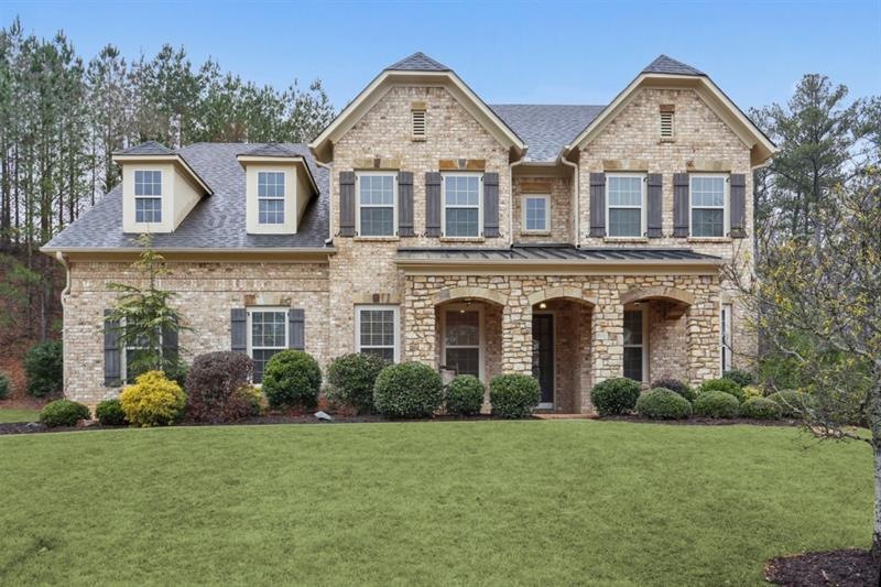 Welcome home to this stately 3 sided brick home!