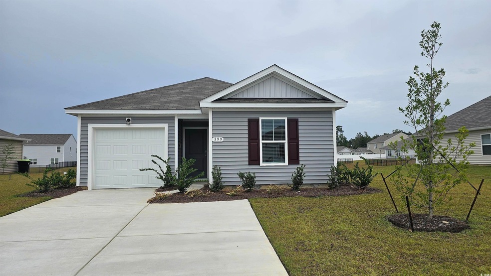 View of front of property featuring a front yard a