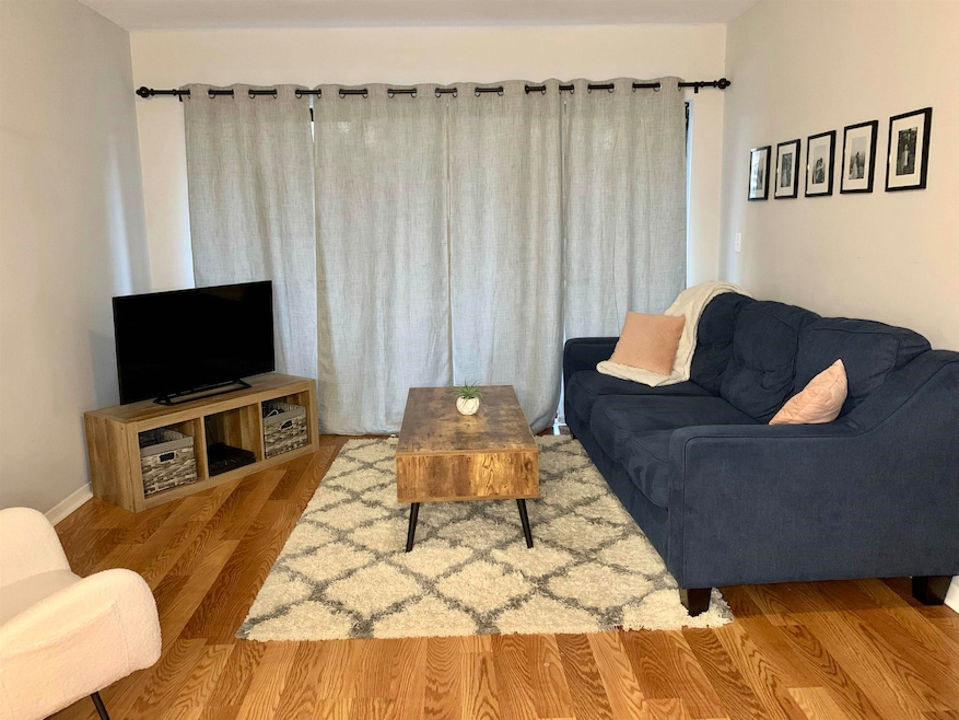 Living room featuring light hardwood / wood-style 