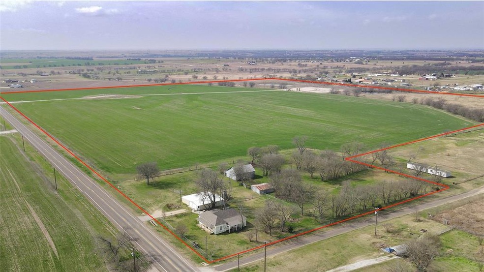 Aerial view of this 83 acre property.  Red boundary lines are approximate.
