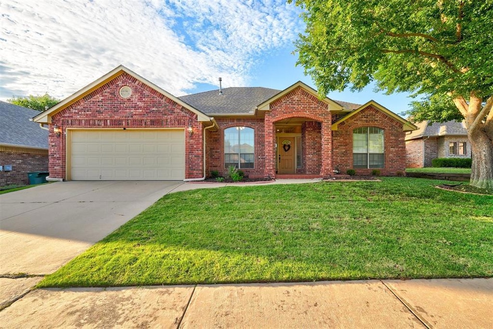 House featuring a front lawn and a garage
