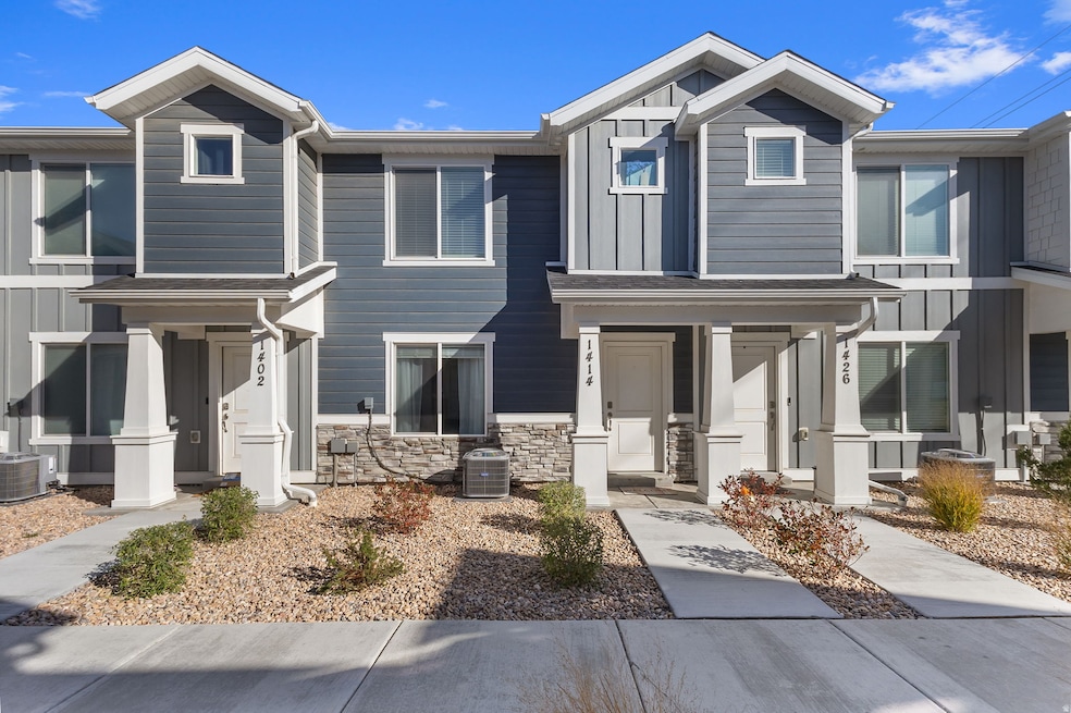View of front of home featuring board and batten siding and stone
