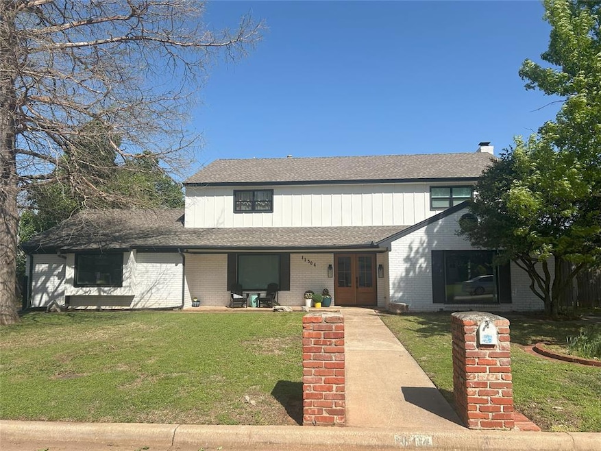 View of front of house with brick siding, french d