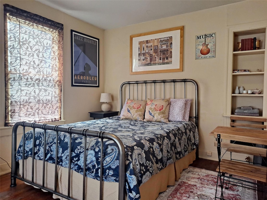 Bedroom with wood finished floors