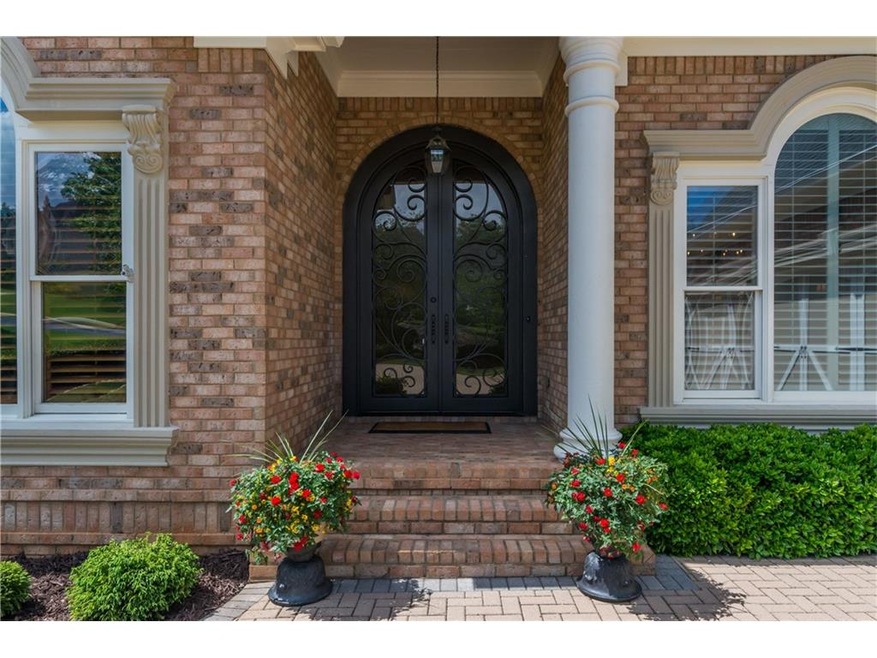 Beautiful scroll iron front doors.  Very castlelike without seeming gaudy.