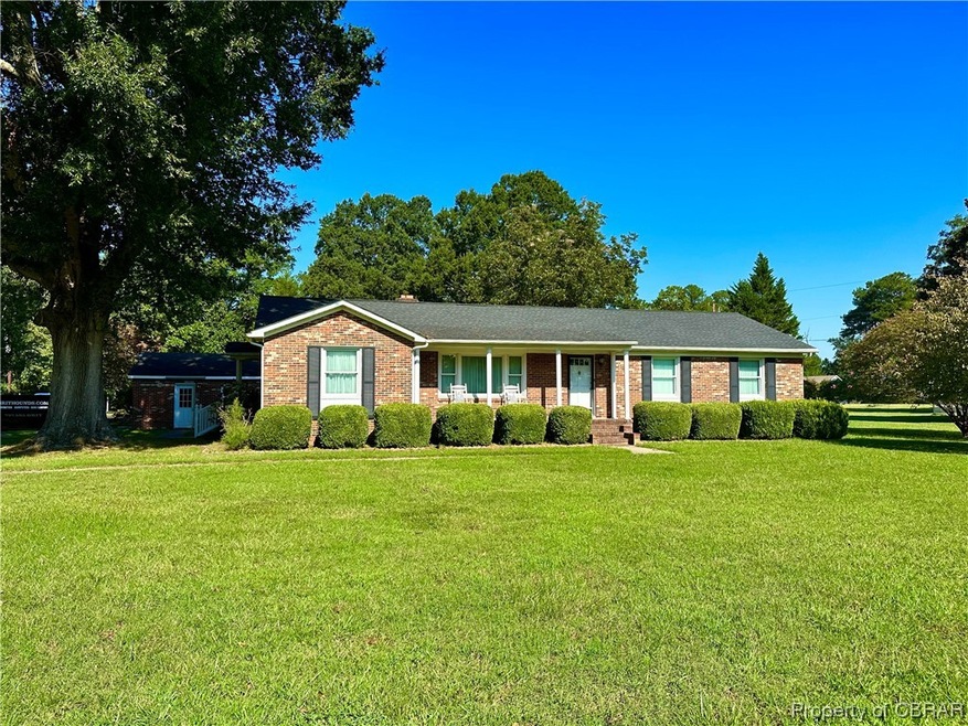 Ranch-style house with a front lawn