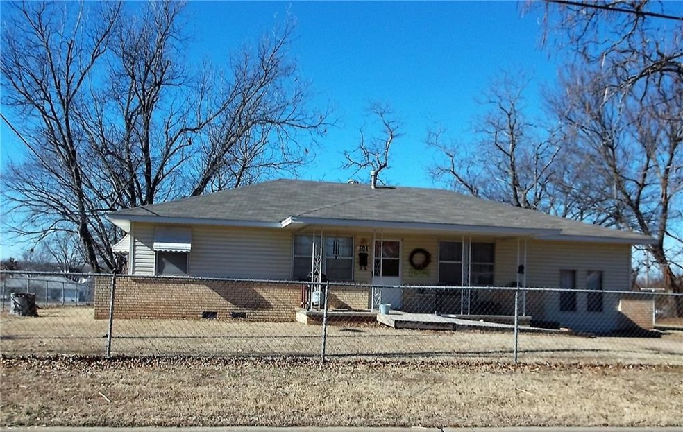 Front view. Very nice fenced yard. carport in back