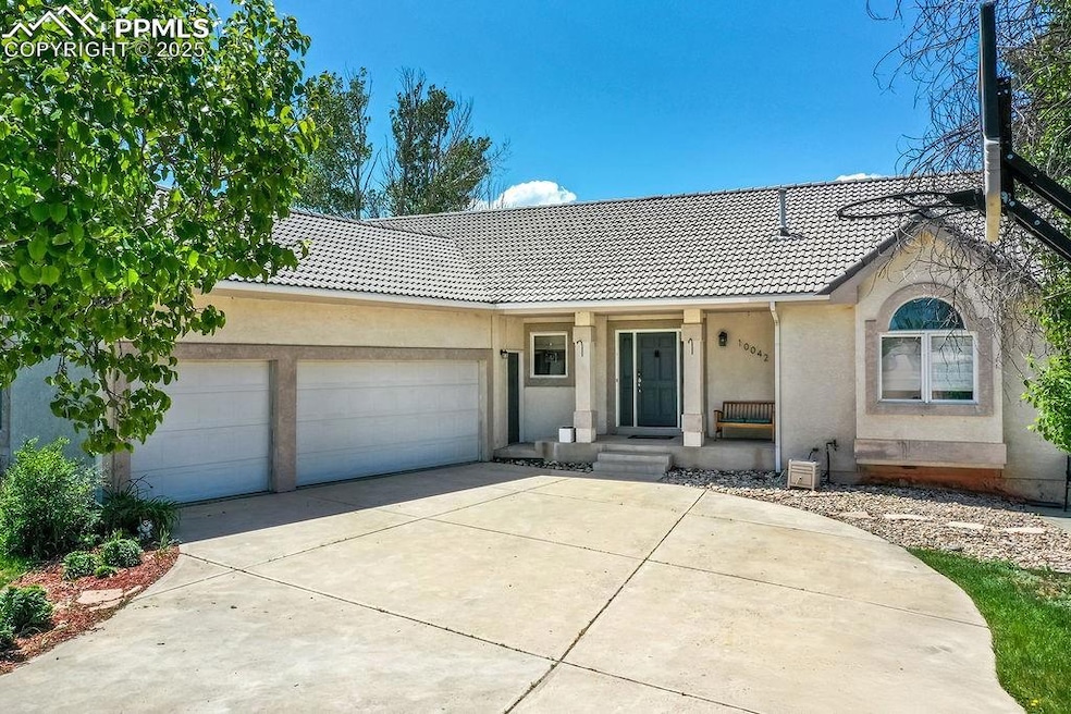 View of front of house featuring large driveway an
