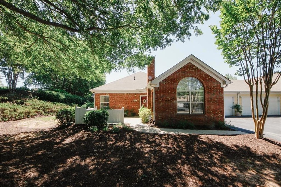 Single story home featuring brick siding
