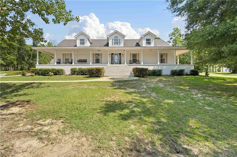 View of front of home featuring a porch and a fron
