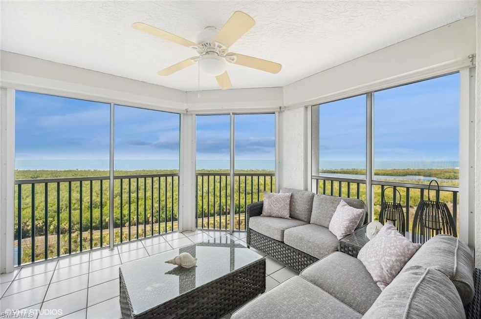 Sunroom / solarium with ceiling fan and a water vi