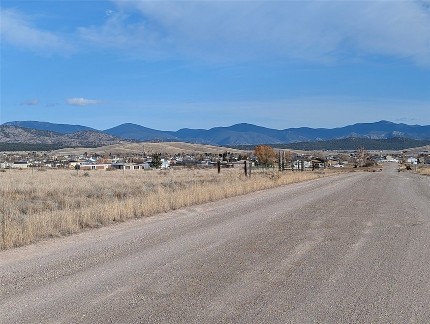 Looking towards southeast corner with lot on left side of road