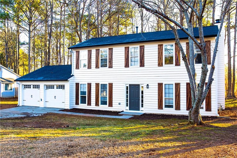 Colonial-style house with a garage