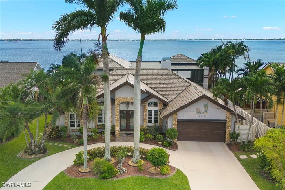 View of front of house featuring concrete driveway