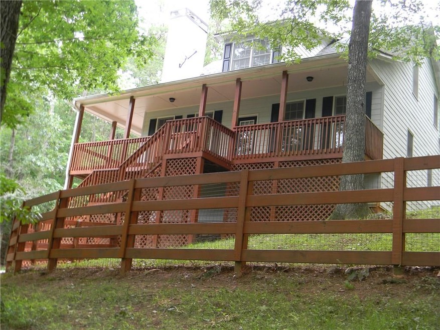 Front deck overlooking private wood lot.  1.25 acr