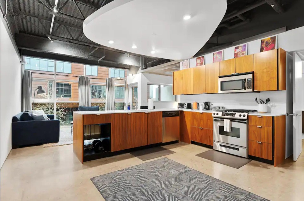 Kitchen with brown cabinets, stainless steel appl