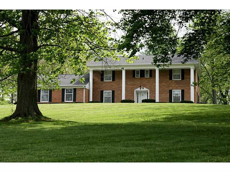 Exterior Front. Stately, hilltop, colonial style brick home.