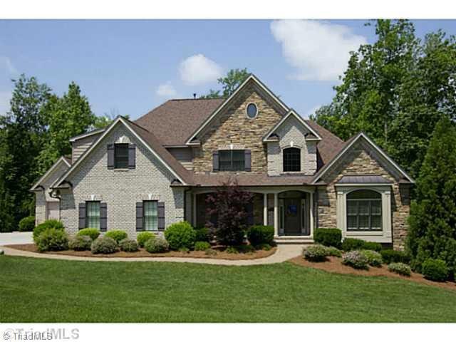 Exterior Front. Welcome Home!  This beautiful custom built home sits on nearly 1 acre on the lake in Heron s Nest!