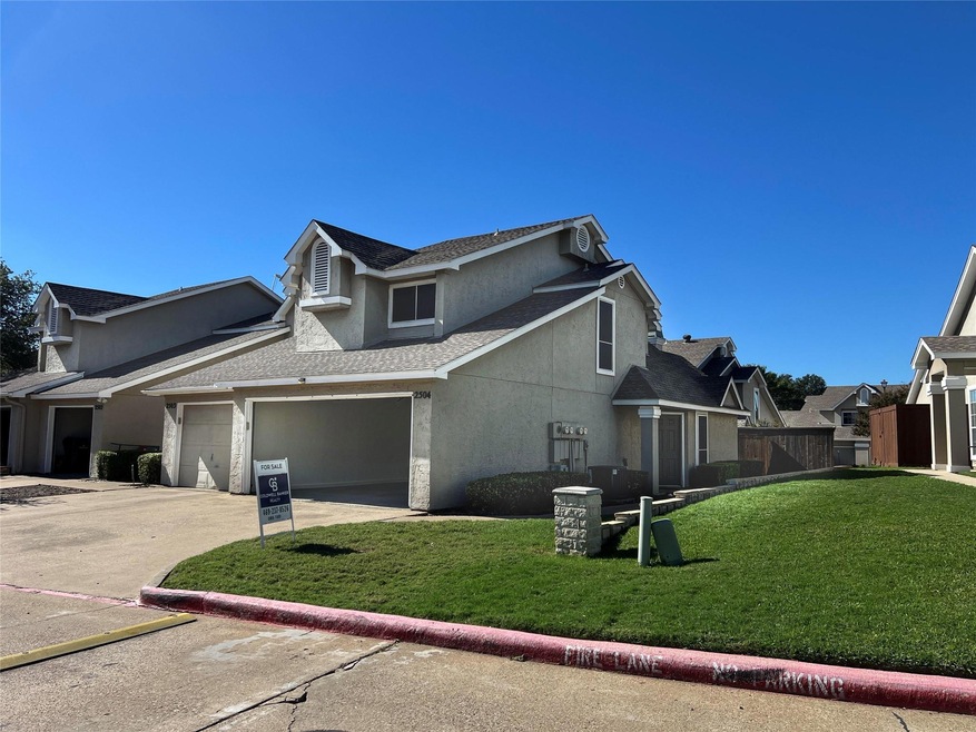 View of property exterior featuring a garage and a