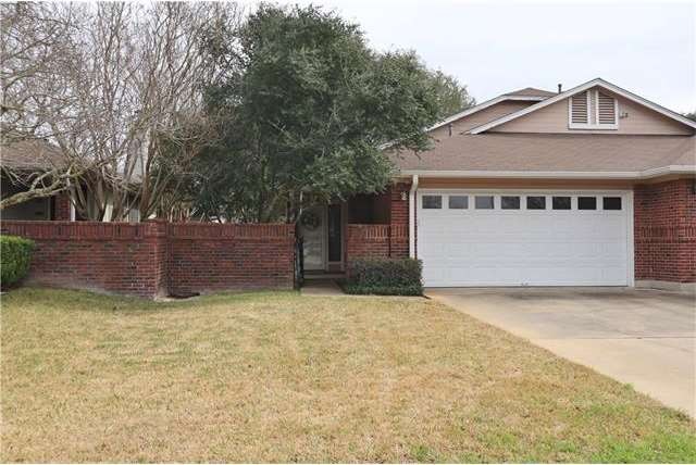 Double door entrance to garage with garage door op