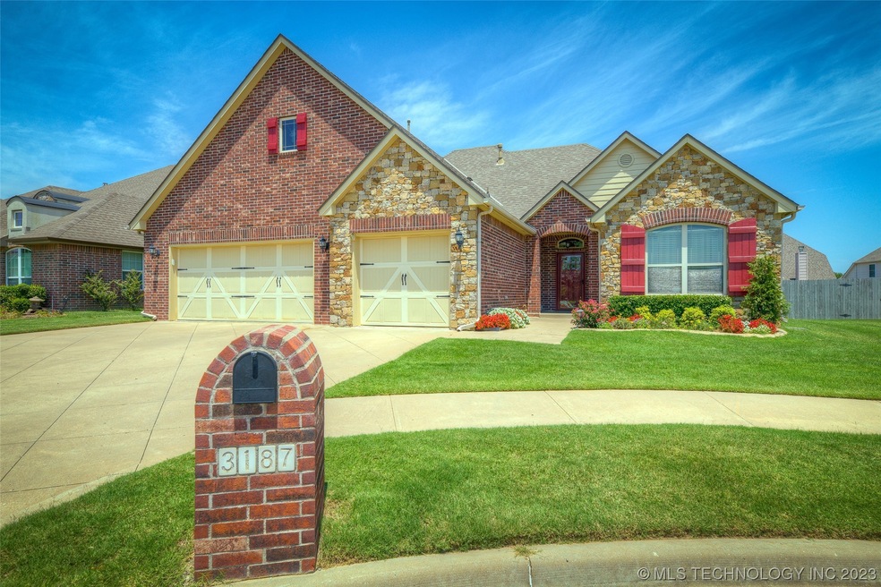oversized driveway on this beautiful home with 3 c