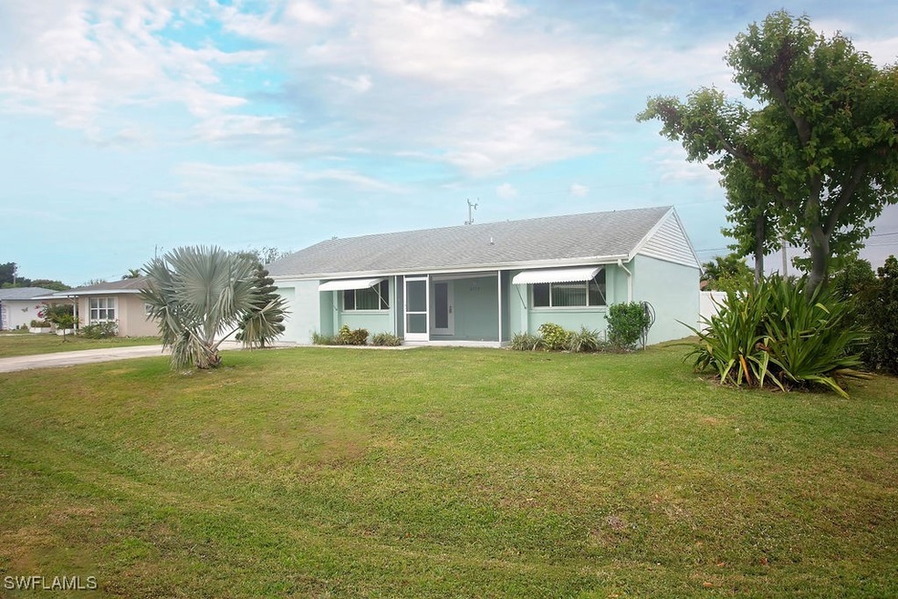 Ranch-style home with a front yard