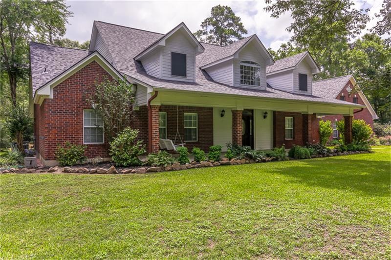 Classic country elevation offers the much desired large covered front porch, & dormers. Brick exterior, structural steel framing, and concrete sub-floors were purposefully designed for long term easy maintenance. New roof installed in October, 2015.