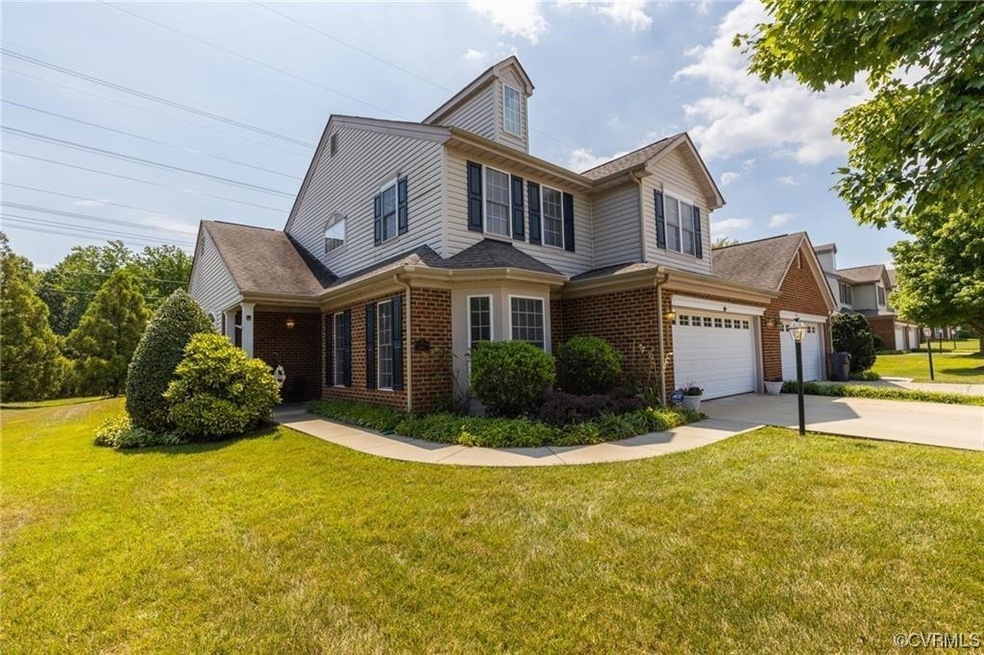 View of front of home with a front lawn and a garage