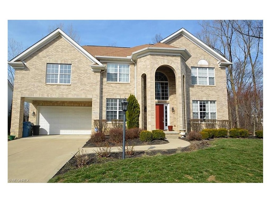 Stately brick front colonial with covered porch en