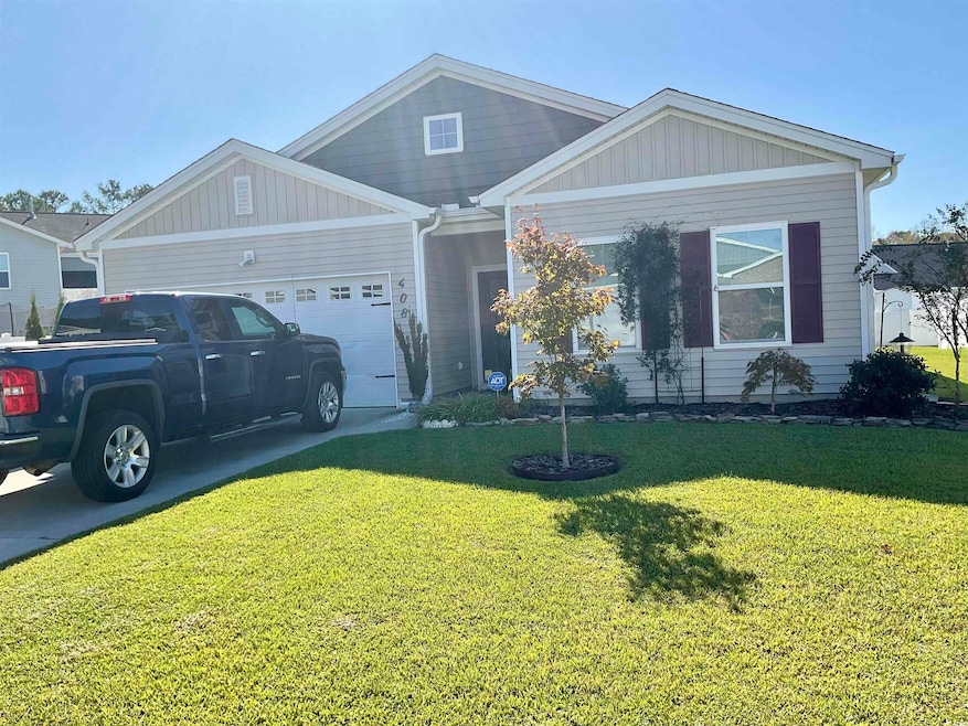 View of front facade featuring a garage and a fron