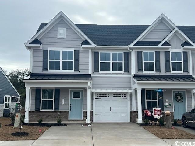 Craftsman house featuring a garage