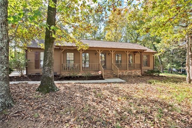 Spacious ranch on almost half acre level wooded lo